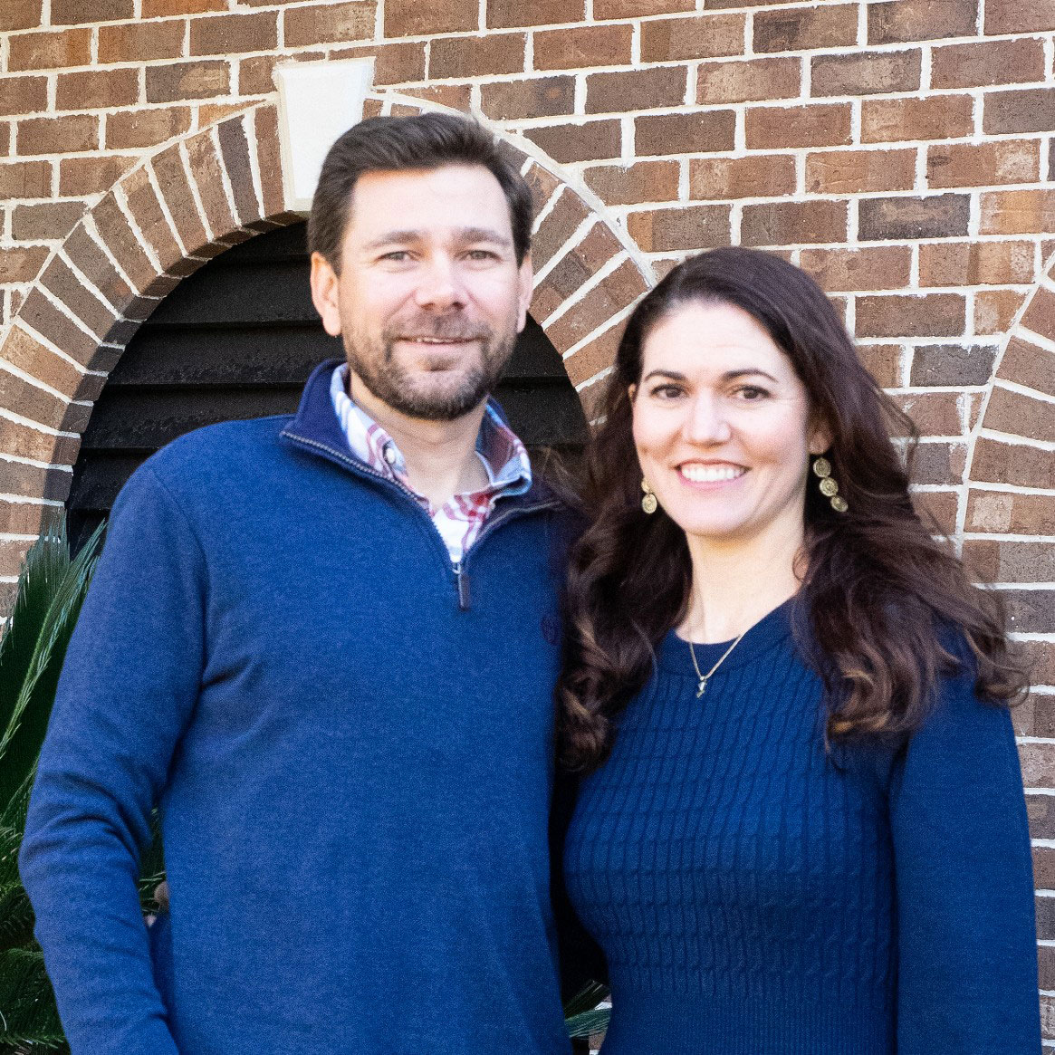 Drs. Cory and Chelsea Allen together outside their Mount Pleasant practice